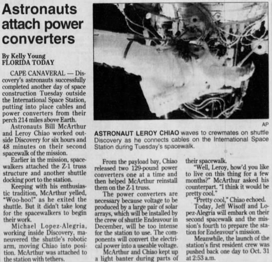 Astronauts attach power converters - 
