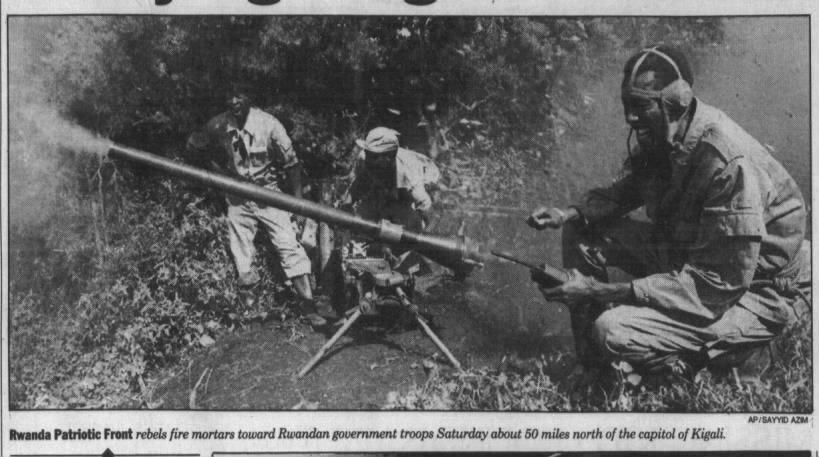 Photo of Rwanda Patriotic Front rebels firing mortars toward government troops