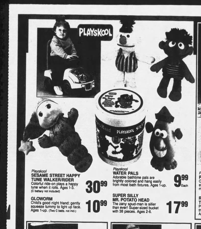 Segment of a Toys'r'us ad, showing the Sesame Street Happy Tune Walker/Rider.