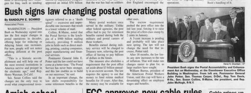 Bush signs law changing postal operations