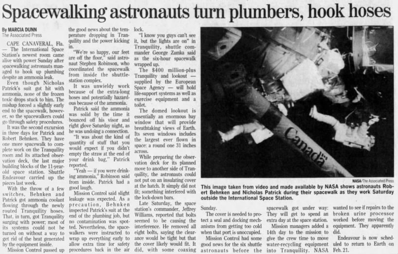 Spacewalking astronauts turn plumbers, hook hoses