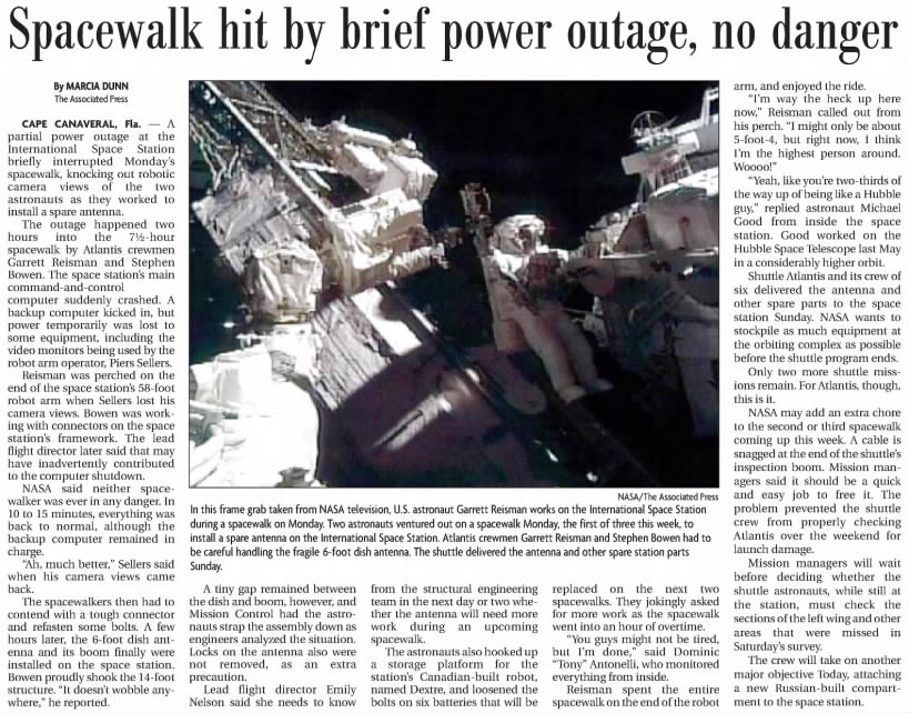 Spacewalk hit by brief power outage, no danger